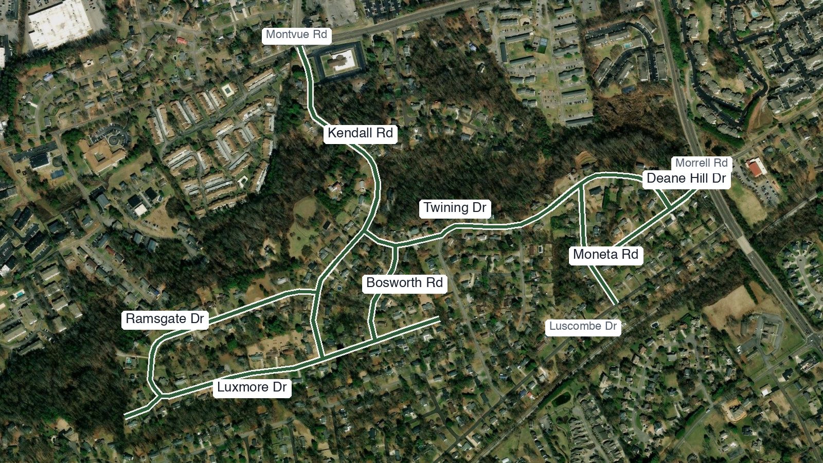 Aerial map with the seven Kingston Hills streets drawn in green: Kendall from Montvue, Twining across to Moneta and the Deane Hill stub at Morrell, Bosworth, the Ramsgate loop, and Luxmore ending at the woods